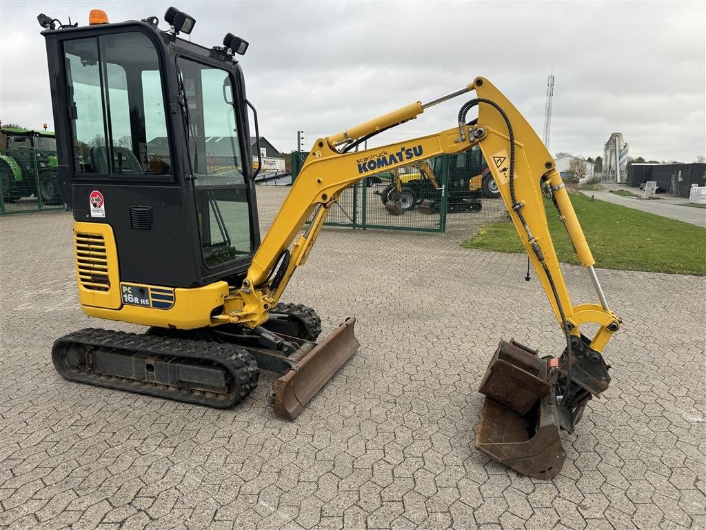 Bagger du type Komatsu PC16R-3HS, Gebrauchtmaschine en Ringe (Photo 1)