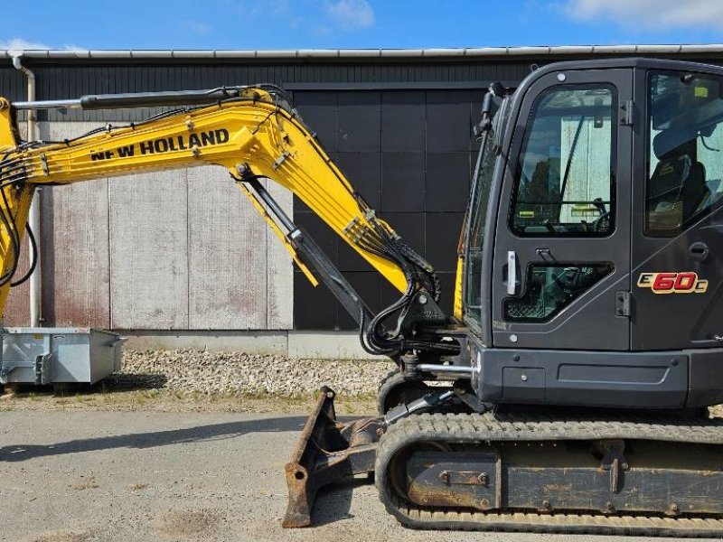 Bagger tipa New Holland E60C, Gebrauchtmaschine u Ringe