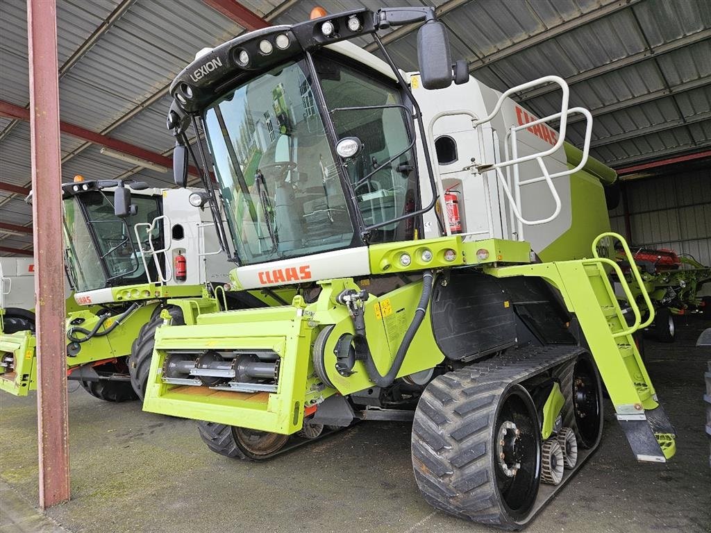 Mähdrescher типа CLAAS LEXION 670 TT  TT og 4WD. INCL. Vario 750 Skærebord. 2 x Laser Pilot. Fin 6 rystermaskine. Ring til Ulrik på  40255544. Jeg snakker Jysk, tysk og engelsk., Gebrauchtmaschine в Kolding (Фотография 1)