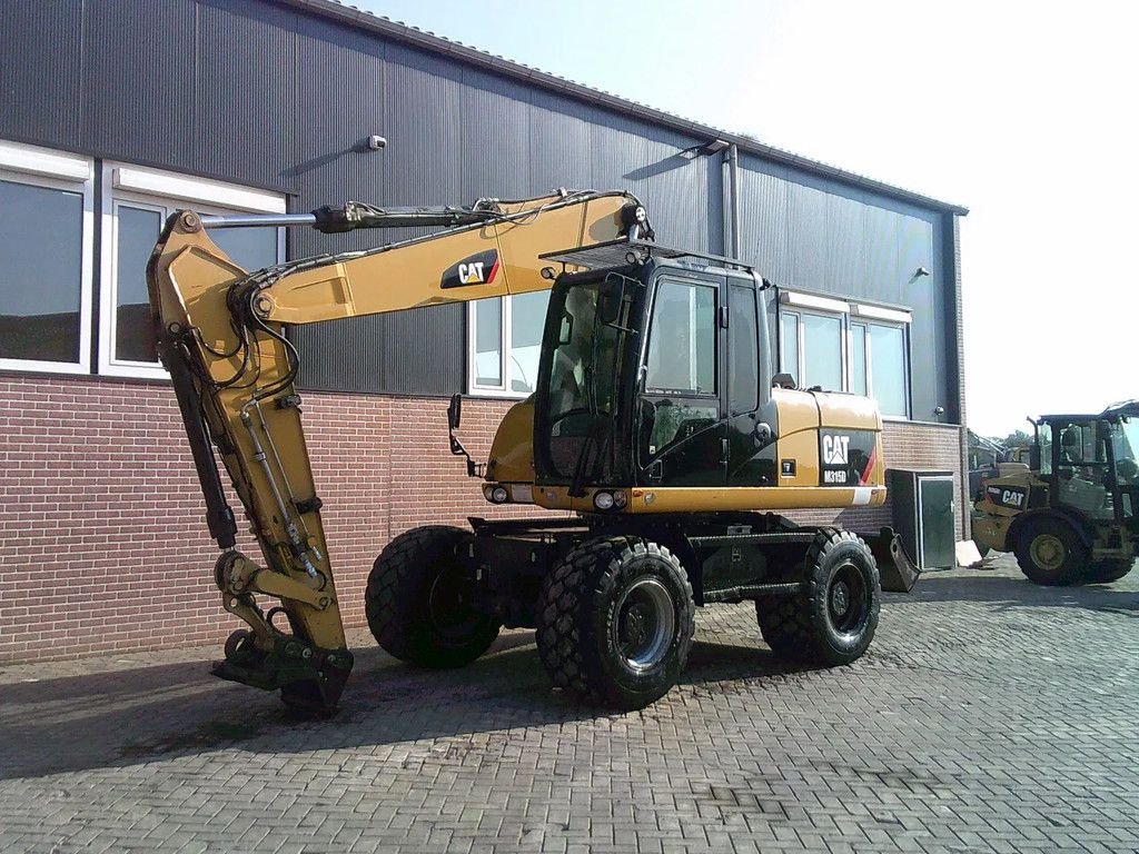 Mobilbagger za tip Caterpillar M315D, Gebrauchtmaschine u Barneveld (Slika 1)