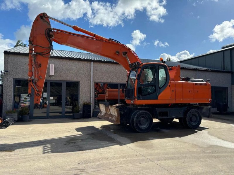 Mobilbagger du type Doosan DX210W, Gebrauchtmaschine en Wevelgem