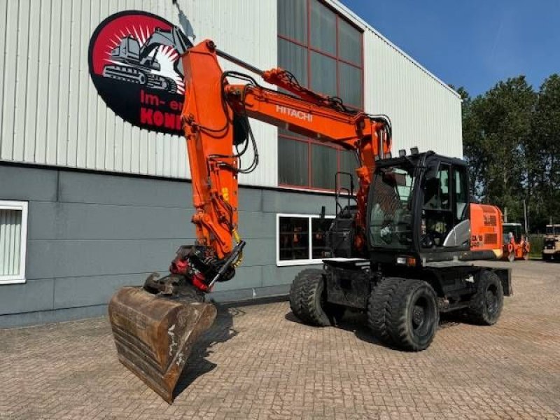 Mobilbagger van het type Hitachi ZX140W-5B with rototilt CW30, Gebrauchtmaschine in Uitgeest (Foto 1)