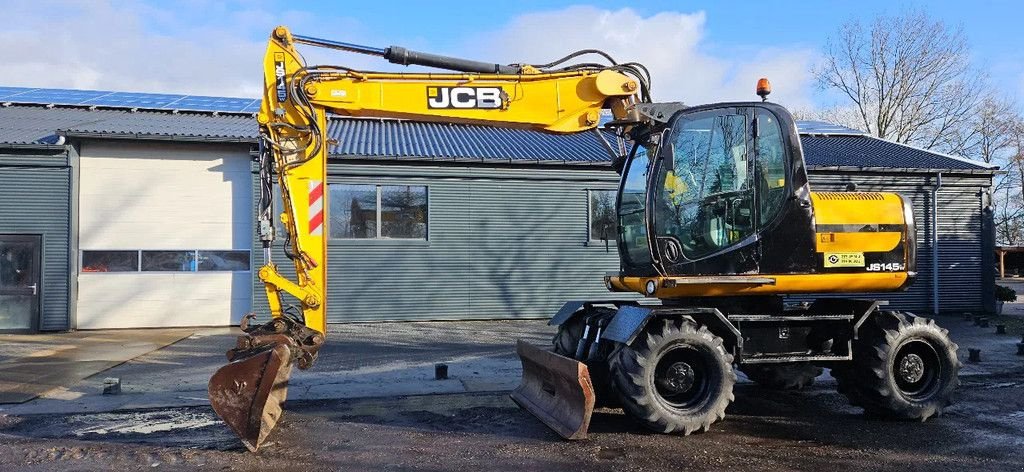 Mobilbagger des Typs JCB JS145 W, Gebrauchtmaschine in Scharsterbrug (Bild 1)