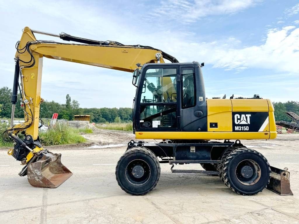 Mobilbagger typu Sonstige Cat M315D - 360&deg; Engcon Rotating Bucket + Grapple, Gebrauchtmaschine v Veldhoven (Obrázek 1)