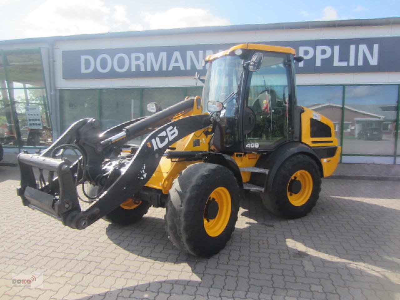 Radlader des Typs JCB 409 AG T4, Gebrauchtmaschine in Schoenberg (Bild 1)