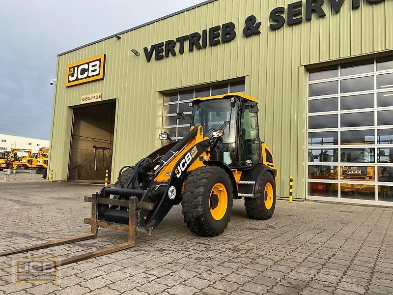 Radlader des Typs JCB 409 Kompaktlader, Gebrauchtmaschine in Frechen (Bild 1)