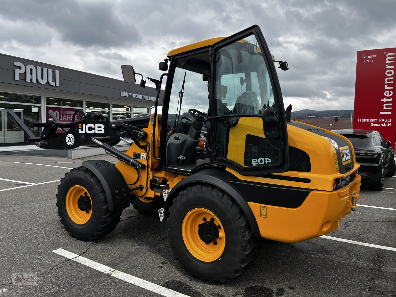 Radlader tip JCB 409, Neumaschine in Regen (Poză 3)