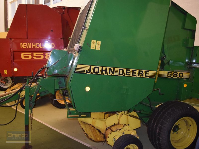 Rundballenpresse van het type John Deere 580, Gebrauchtmaschine in Oyten (Foto 1)