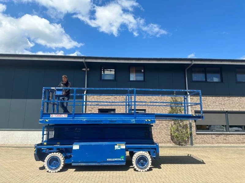 Teleskoparbeitsbühne van het type Holland Lift Q-135EL18 Elektra Schaarhoogwerker 15.5 meter werkhoogte 873 uur, Gebrauchtmaschine in VEEN (Foto 1)