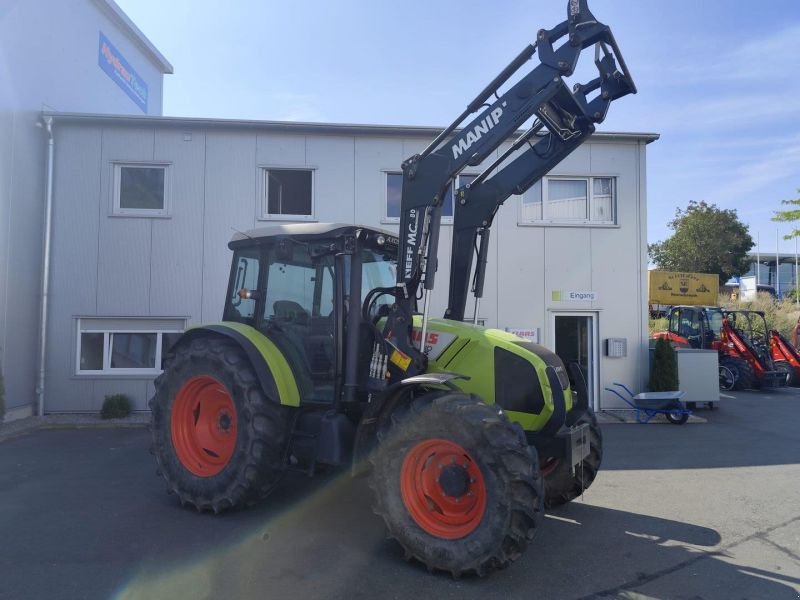 Traktor типа CLAAS AXOS 310 MIT MANIP MC-80, Gebrauchtmaschine в Hof