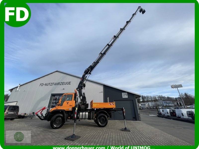 Traktor of the type Mercedes-Benz Unimog U500 mit Mega Kran,  viele Extras auch Zapfwelle, Kipper, Funk, Automatik, Gebrauchtmaschine in Hinterschmiding (Picture 1)