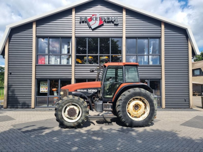 Traktor van het type New Holland M160, Gebrauchtmaschine in Lunteren (Foto 1)