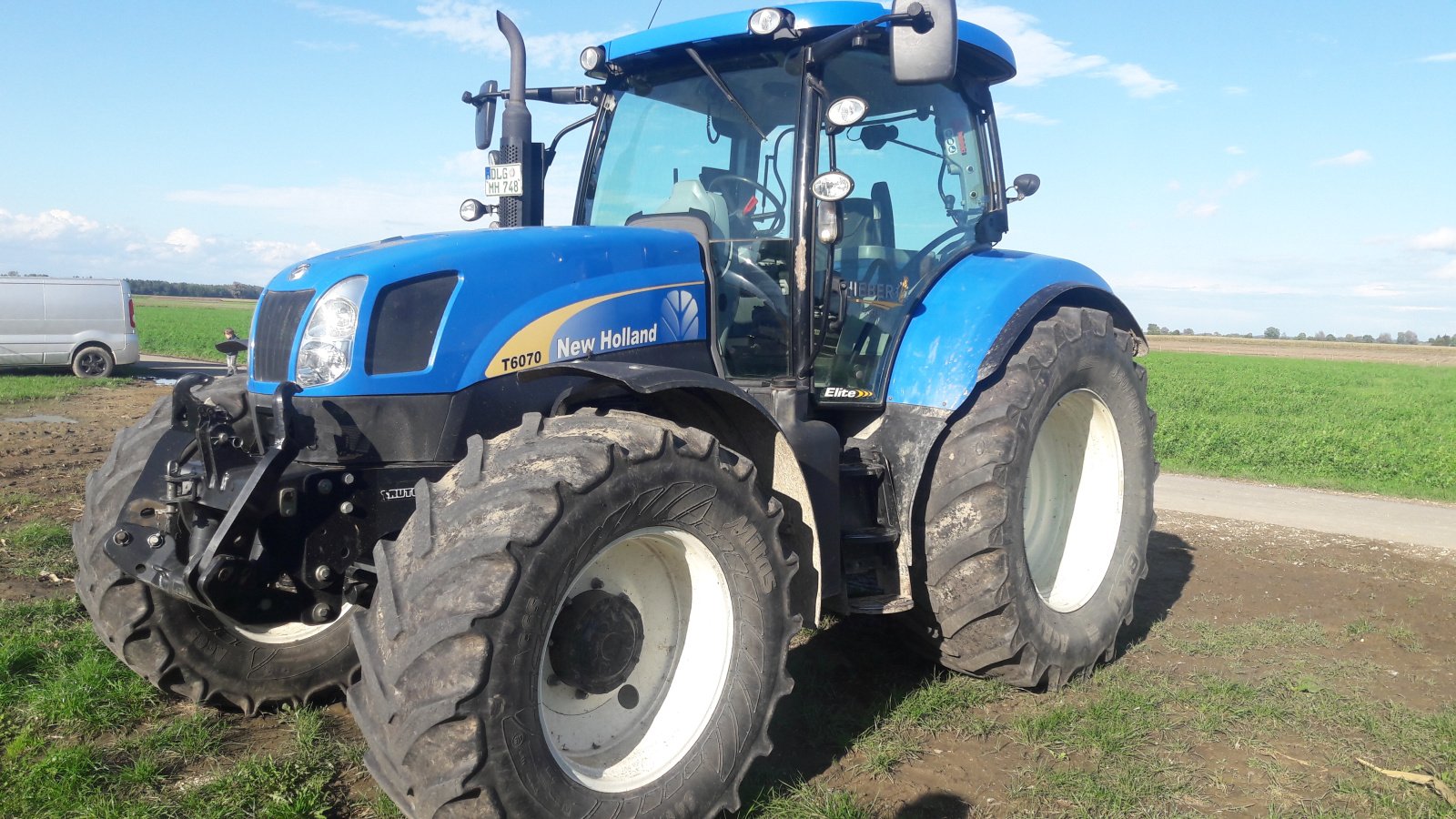 Traktor Türe ait New Holland T 6070, Gebrauchtmaschine içinde Aislingen (resim 1)