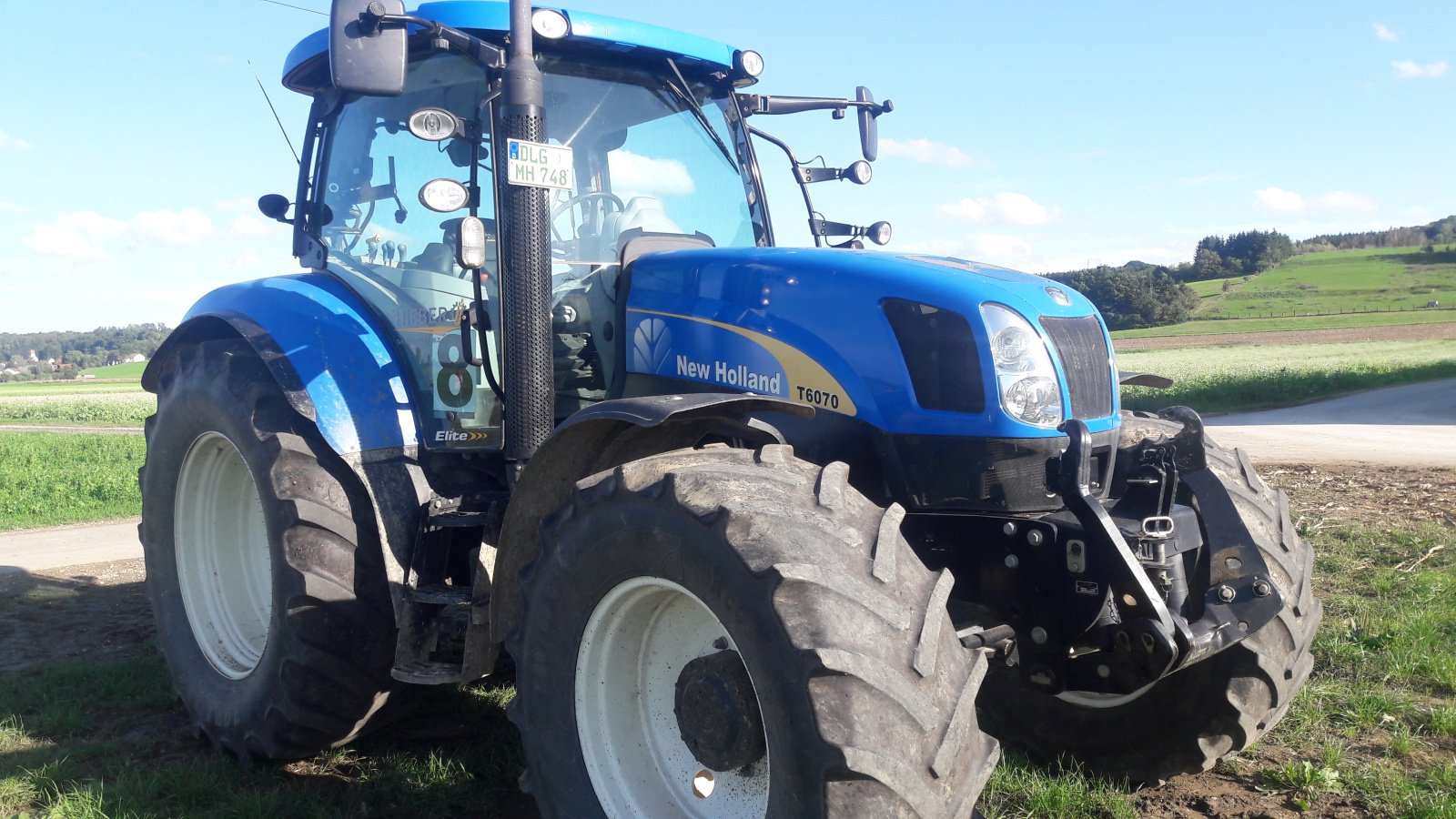 Traktor Türe ait New Holland T 6070, Gebrauchtmaschine içinde Aislingen (resim 2)