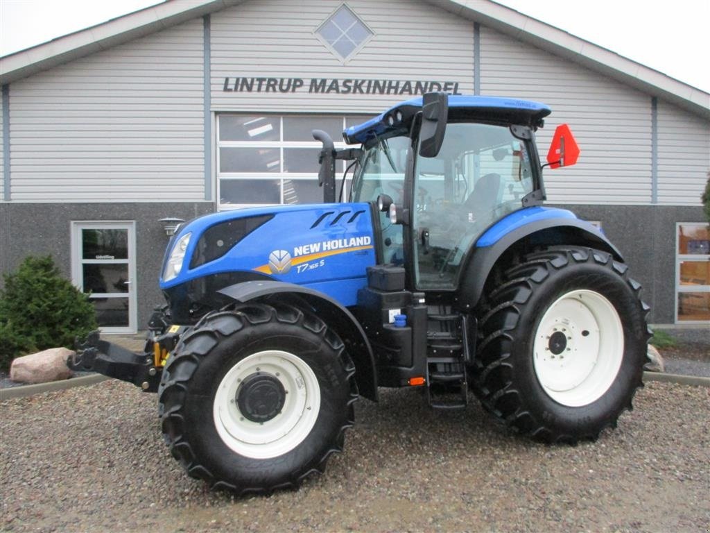 Traktor tipa New Holland T7.165  Med frontlift, frontPTO og fuld affjedring KUN 834 Timer, Gebrauchtmaschine u Lintrup (Slika 1)