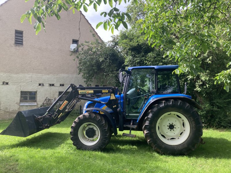 Traktor типа New Holland TL100 A, Gebrauchtmaschine в Döckingen (Фотография 1)