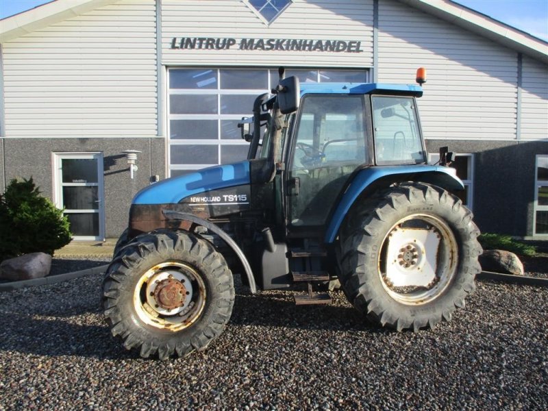 Traktor от тип New Holland TS115 SLE, Gebrauchtmaschine в Lintrup (Снимка 1)